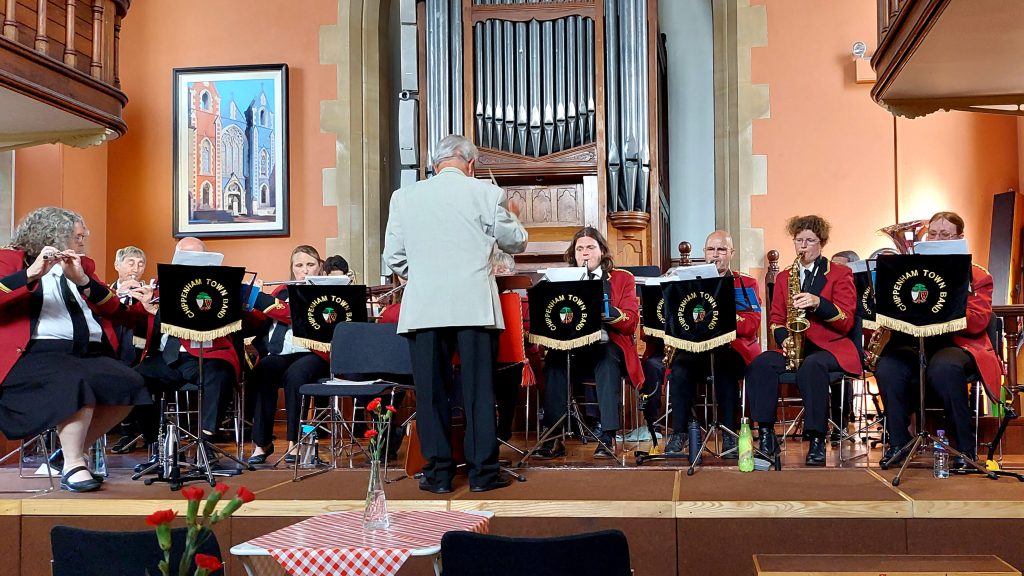 Concert band playing on the stage at The Cause