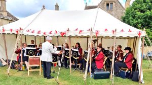 Concert band in a marquee performing at the Biddestone Fete